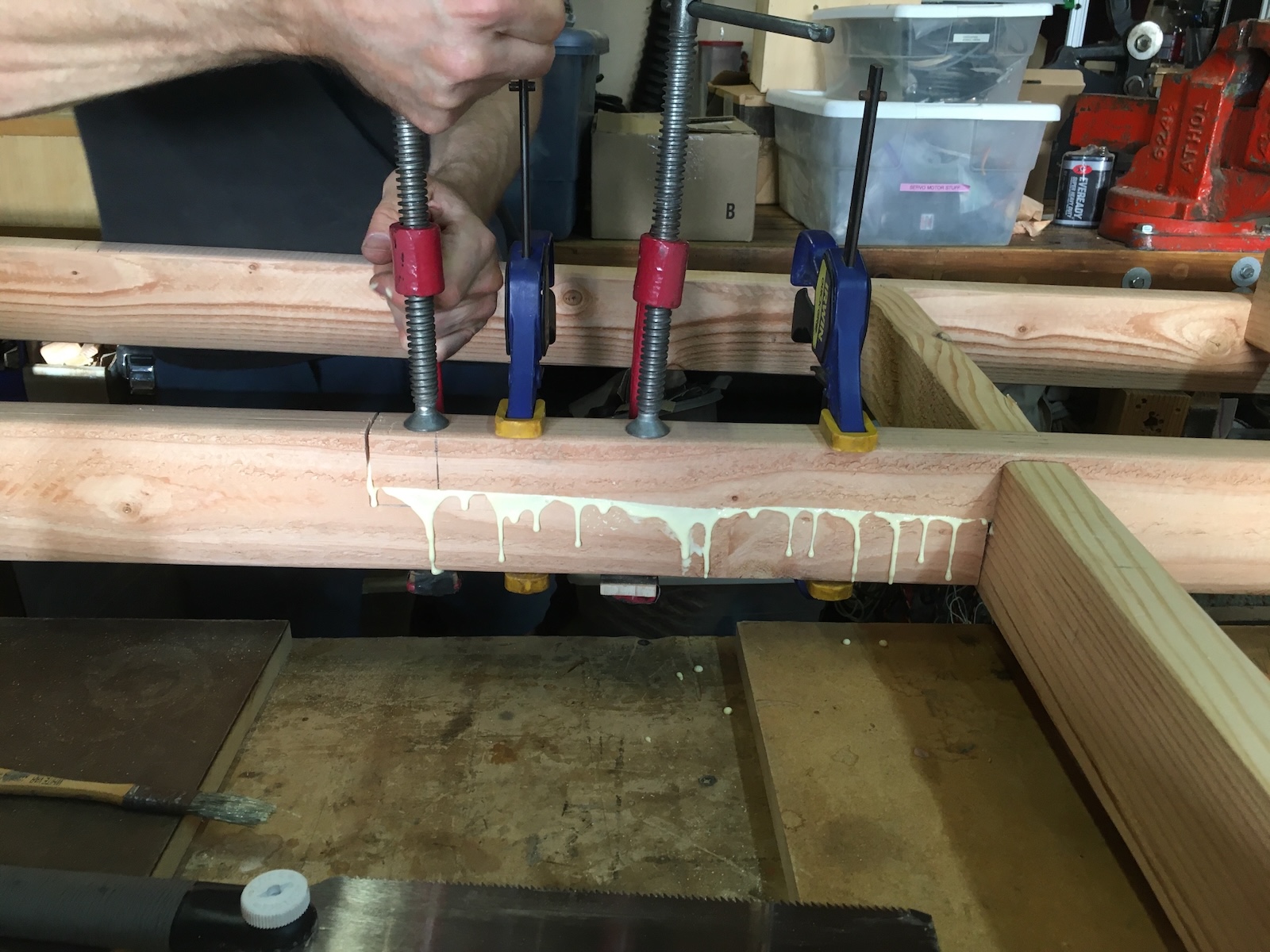 Clamping a wood glue-up on a workbench