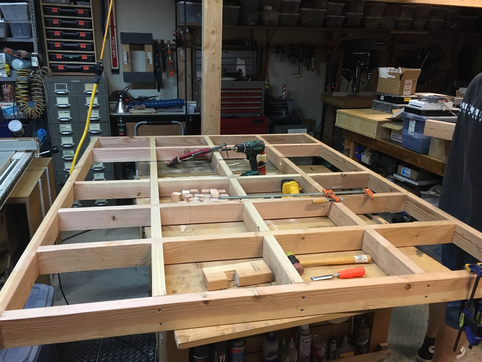 Unwrapping acrylic sheet on workshop floor