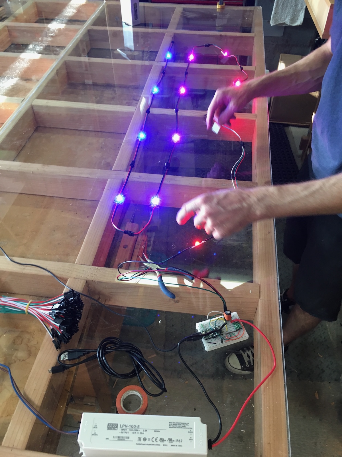 RGB LEDs being wired in wooden frame